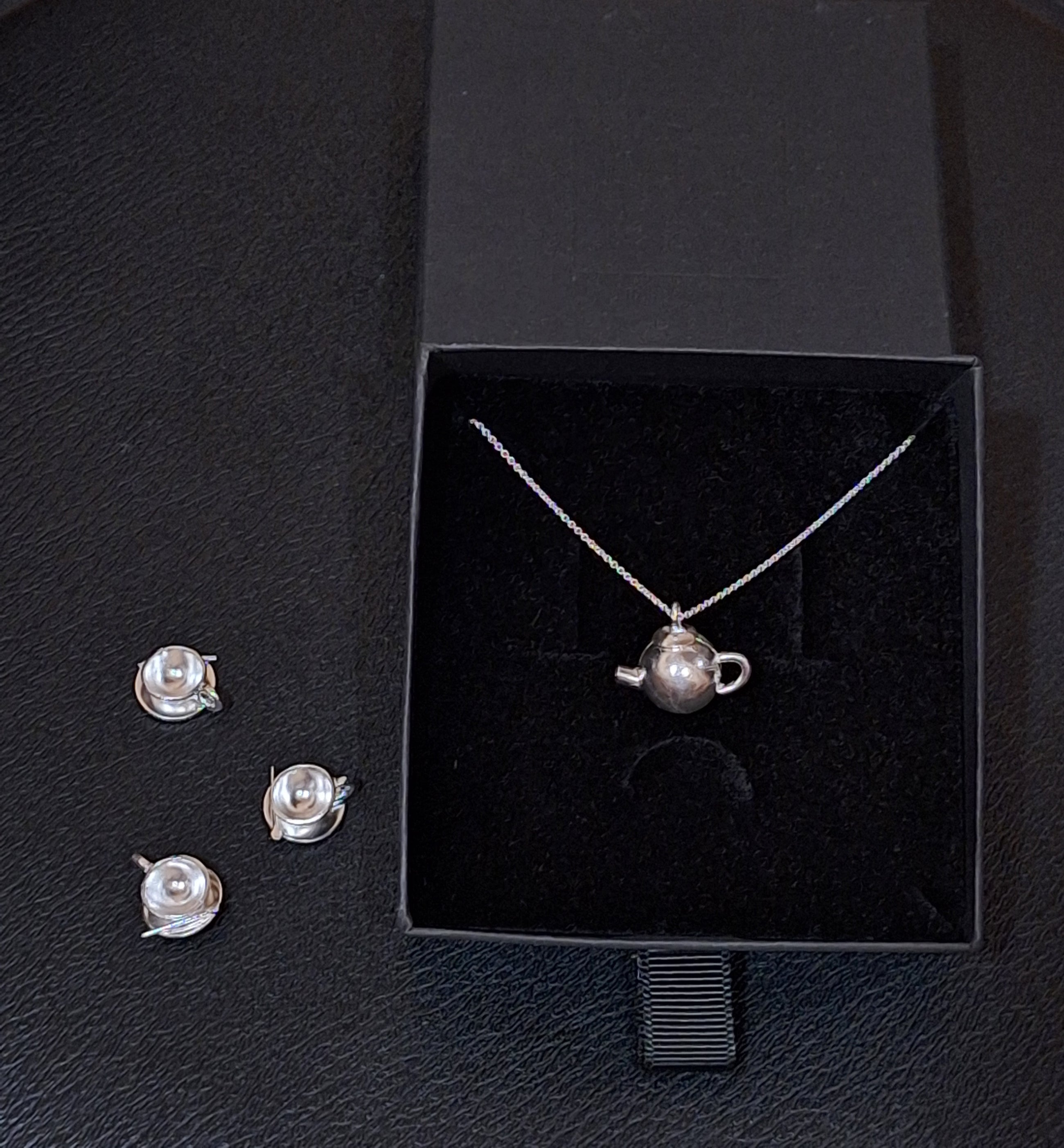 Sterling silver cup and saucer necklace