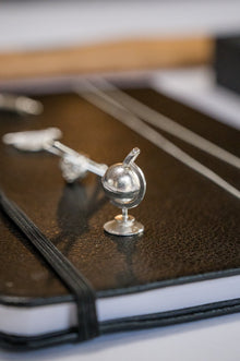Sterling silver spinning globe (Object)