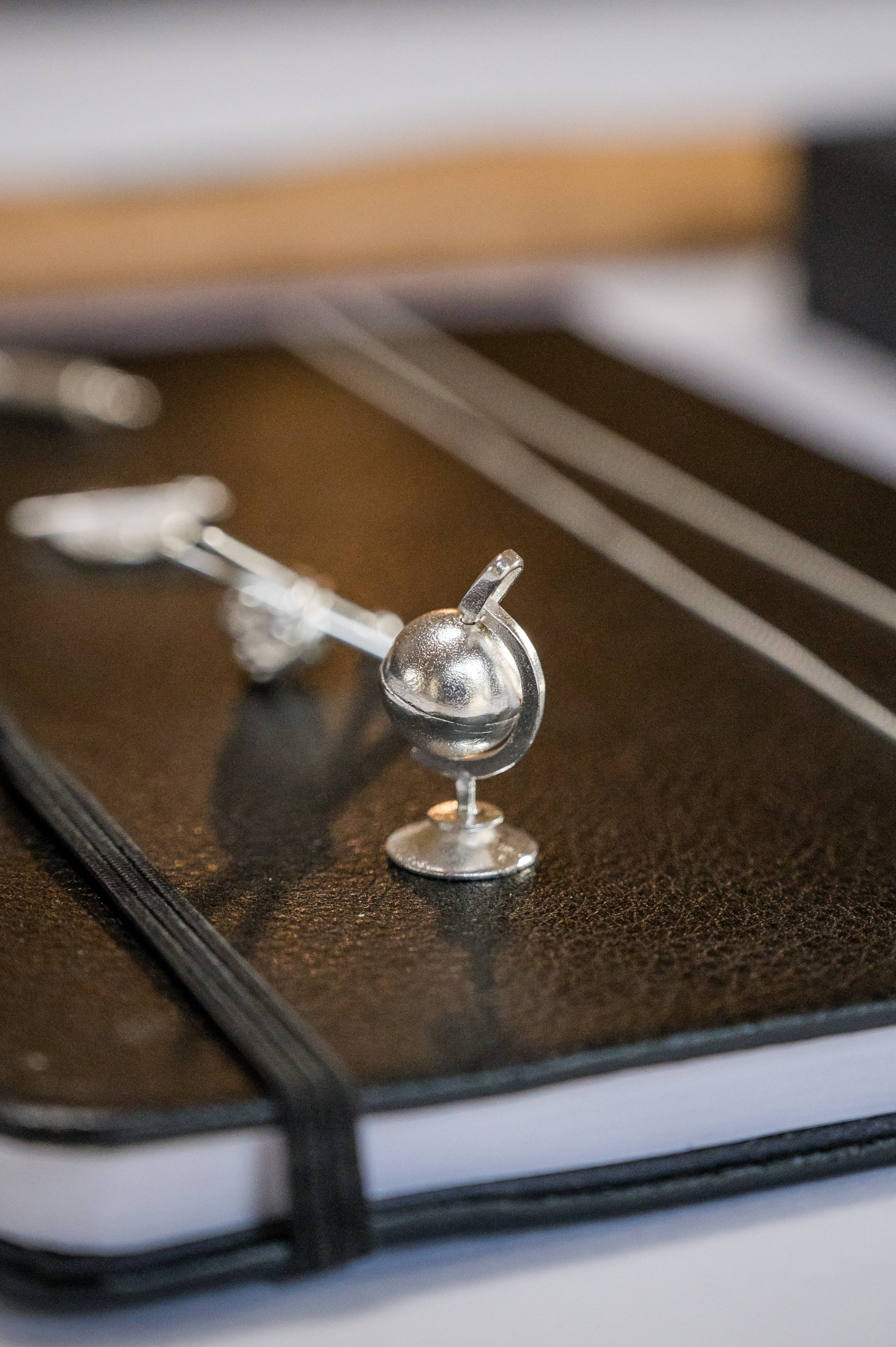 Sterling silver spinning globe (Object)