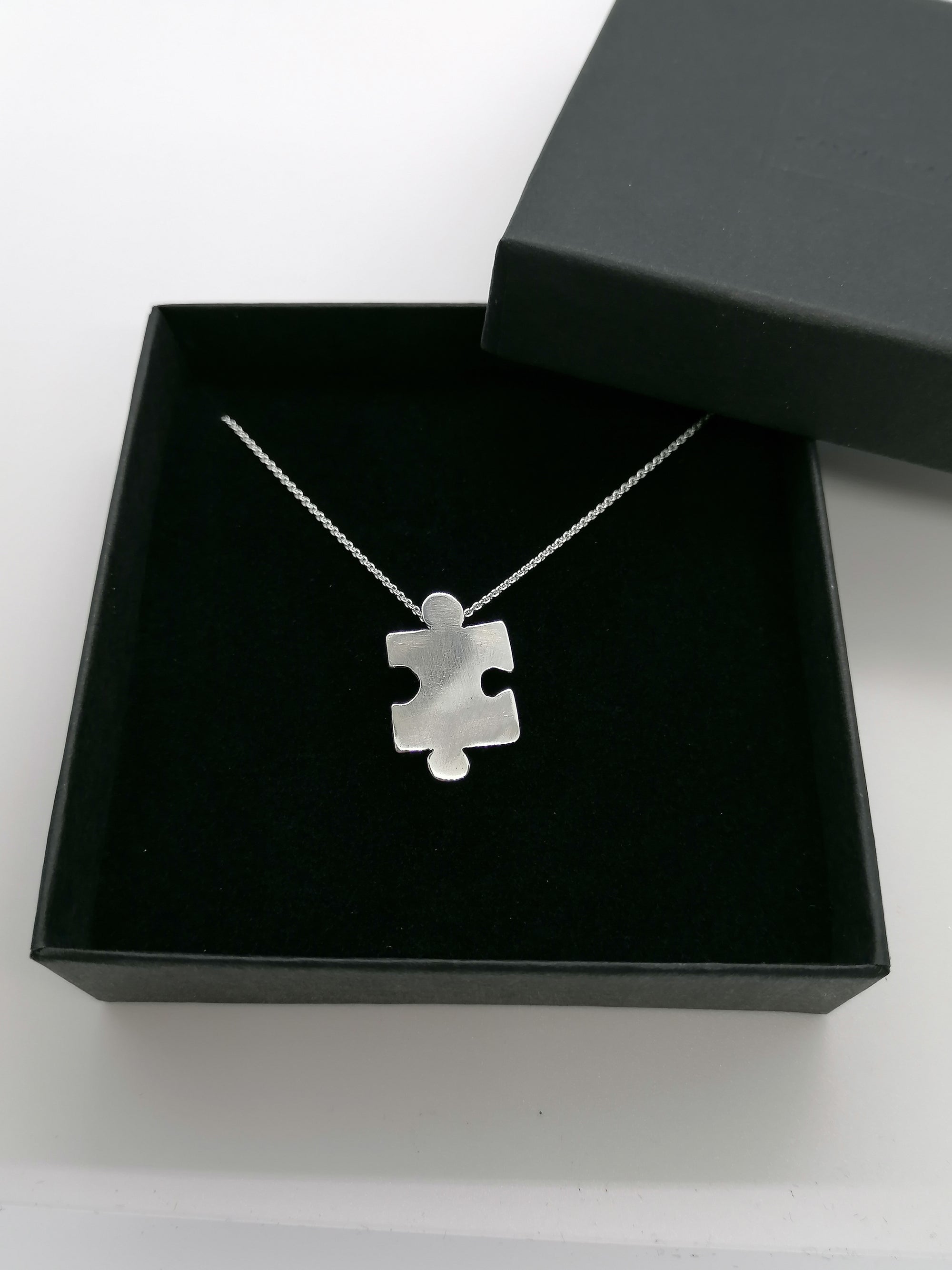 Sterling silver jigsaw puzzle necklace