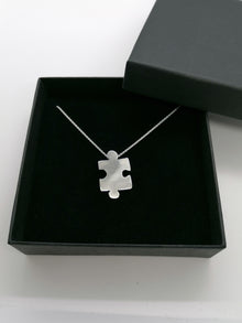 Sterling silver jigsaw puzzle necklace