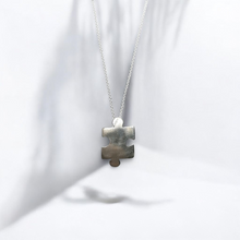 Sterling silver jigsaw puzzle necklace