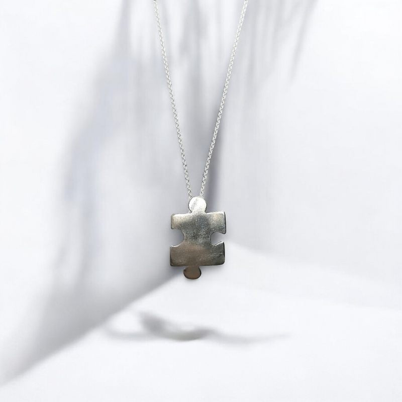 Sterling silver jigsaw puzzle necklace