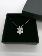 Sterling silver jigsaw puzzle necklace - Saw Framed