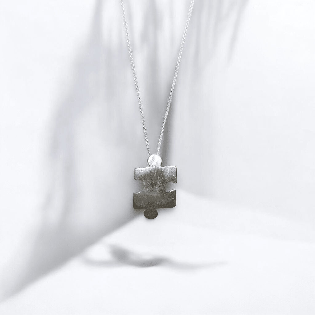 Sterling silver jigsaw puzzle necklace - Saw Framed