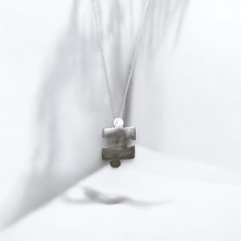 Sterling silver jigsaw puzzle necklace - Saw Framed